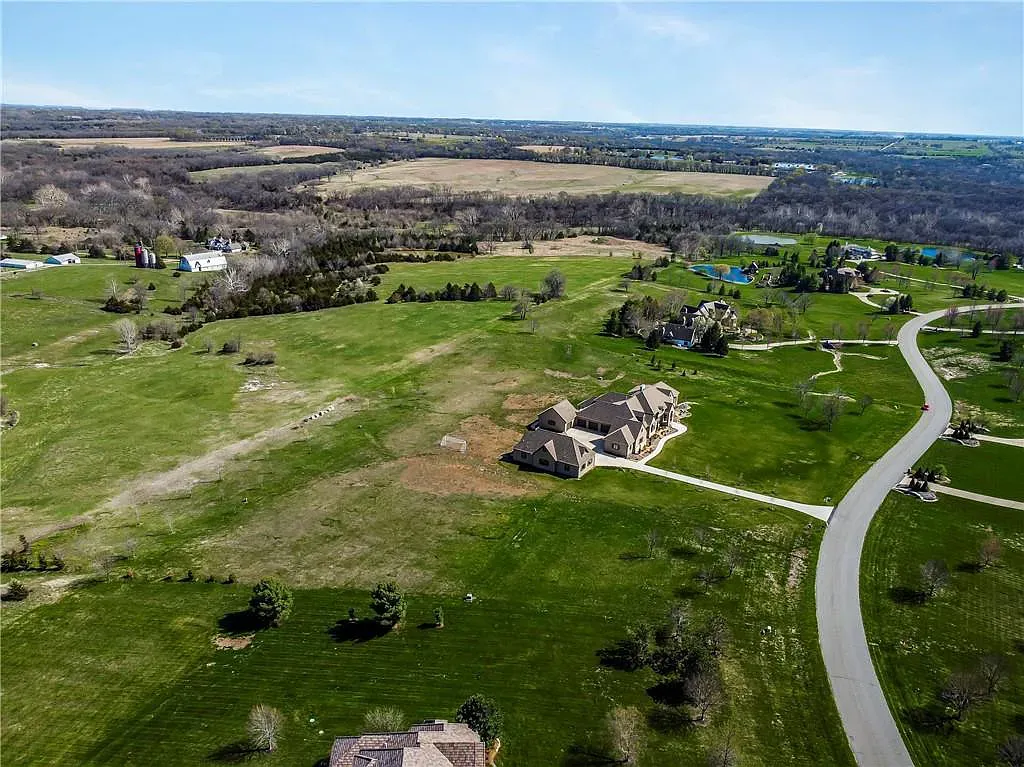 18111 Melrose Drive Home in Overland Park, Kansas. Stunning estate property situated on nearly 8 acres in the coveted Wolf Valley. With over 7600 square feet of living space and an astounding 12 garage spaces, this property offers everything you could ever need.