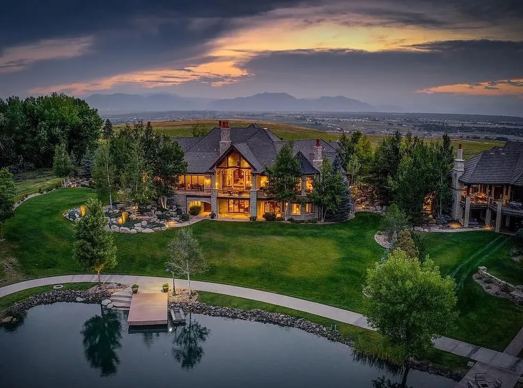 1880 Mallard Drive Home in Broomfield, Colorado. Meta Description: Explore this exceptional 11,393 square foot custom-built home in Colorado, boasting impeccable attention to detail and lavish finishes. With stunning views of the Front Range, Flatirons, and a private lake, this exclusive property offers 6 bedrooms, a movie theater, wine cellar, gym, and more. Enjoy the outdoor spaces featuring Colorado Buff Sandstone decks and a heated driveway. Experience luxury living at its finest with radiant floor heating, hand-scraped Walnut hardwood floors, and artisan plaster walls.