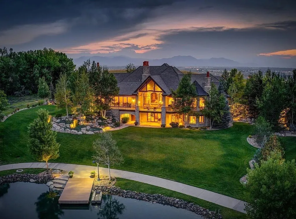 1880 Mallard Drive Home in Broomfield, Colorado. Meta Description: Explore this exceptional 11,393 square foot custom-built home in Colorado, boasting impeccable attention to detail and lavish finishes. With stunning views of the Front Range, Flatirons, and a private lake, this exclusive property offers 6 bedrooms, a movie theater, wine cellar, gym, and more. Enjoy the outdoor spaces featuring Colorado Buff Sandstone decks and a heated driveway. Experience luxury living at its finest with radiant floor heating, hand-scraped Walnut hardwood floors, and artisan plaster walls.