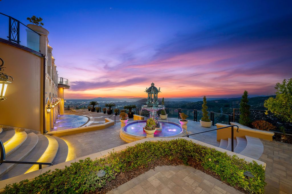 1903 Saxton Lane Home in El Cajon, California. Discover unparalleled luxury living in this custom-built, handcrafted mountaintop estate with unobstructed views. Designed by renowned architect John Jensen AIA and built by Tony Mezain AME Proline Inc, this 13,631 sqft retreat features 5 bedrooms, 9 bathrooms, and exquisite attention to detail. 