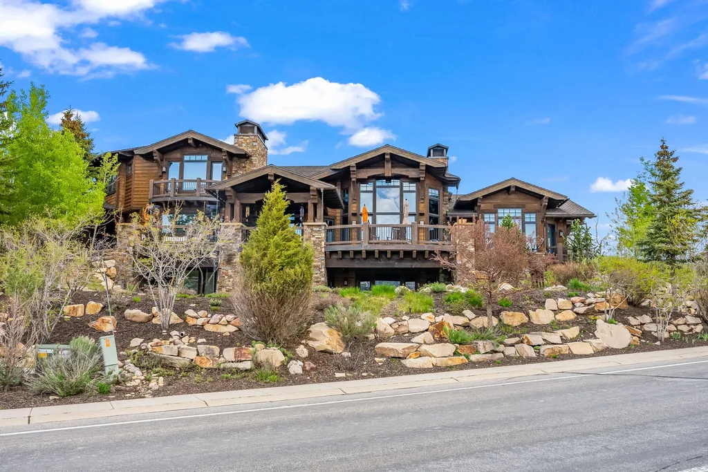 3349 Meadows Drive Home in Park City, Utah. Perched atop Meadows Drive, this exceptional home offers unparalleled vistas of the Uintas, Deer Valley, and Park City ski runs. Designed by renowned architect Michael Upwall, this custom residence is situated on a unique lot, providing unmatched privacy with dedicated open space and hiking trails on the North and East sides. 
