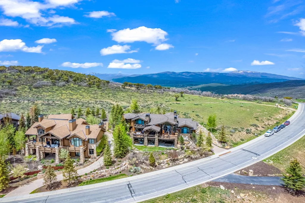 3349 Meadows Drive Home in Park City, Utah. Perched atop Meadows Drive, this exceptional home offers unparalleled vistas of the Uintas, Deer Valley, and Park City ski runs. Designed by renowned architect Michael Upwall, this custom residence is situated on a unique lot, providing unmatched privacy with dedicated open space and hiking trails on the North and East sides. 