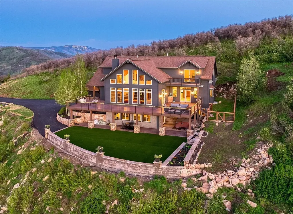 45200 Diamondback Way Home in Steamboat Springs, Colorado. Escape to a tranquil mountain retreat on Diamondback Way, offering breathtaking views and complete privacy just minutes from downtown Steamboat. This expansive property boasts 40 acres, hiking trails, and outdoor living spaces. The home features a great room with vaulted ceilings, a central kitchen for entertaining, and 6 bedrooms including primary suites. Enjoy the outdoors with a fire pit, hot tub, and acres of land for recreation. Horses are welcome, and the property has a high-producing well. Embrace the beauty of Steamboat's natural surroundings at this remarkable retreat.