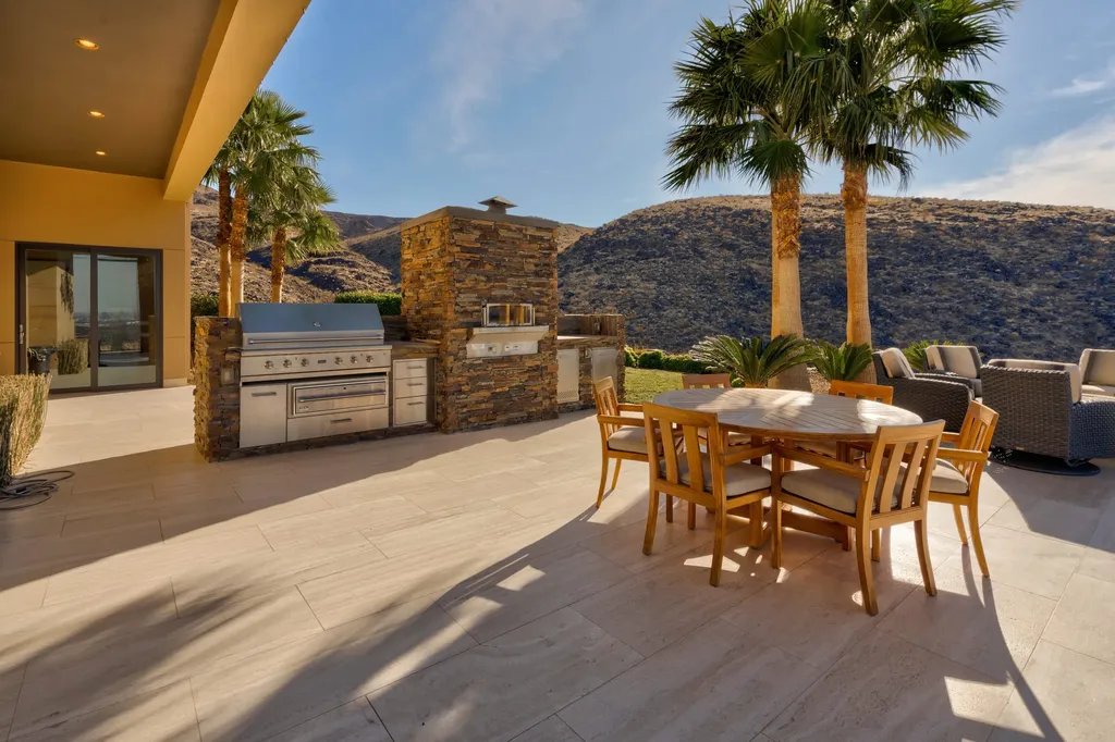 This extraordinary estate located at 761 Dragon Ridge Drive in Henderson, NV offers an unparalleled level of luxury and sophistication. Situated within the exclusive 9-lot enclave in Macdonald Highlands, this magnificent residence is nestled on a sprawling 1.23-acre lot, providing ample space and privacy.