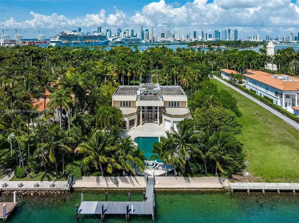 This stunning Star Island Drive property at 37 Star Island Drive, Miami Beach, Florida features 6 bedrooms, 9 bathrooms on a 0.92-acre lot. With a 40,000 square feet manicured lot and 100 ft of waterfront, this gated residence also boasts Travertine floors, custom millwork, a chef's kitchen, and expansive living and entertainment areas with amazing bay and pool views.