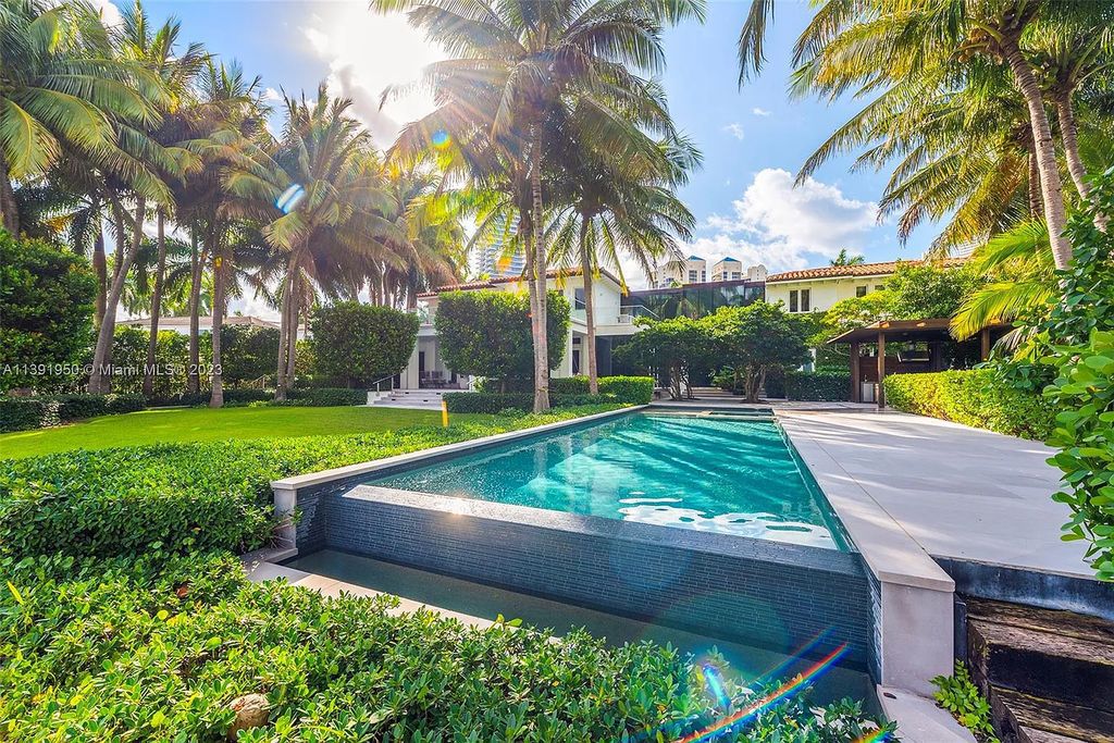 Introducing 100 Golden Beach Drive, Golden Beach, Florida—a luxurious waterfront estate offering unmatched privacy and grandeur. This bespoke 7,500+ sqft home, built in 2004, is a sanctuary of opulence and meticulous design.