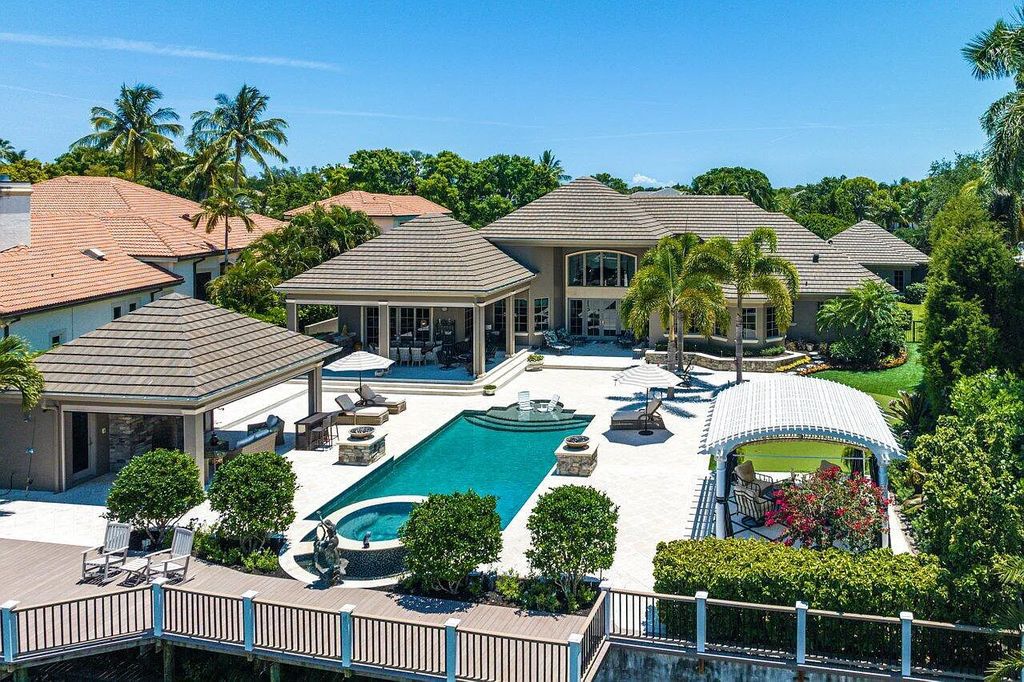 Luxury living awaits at 376 Eagle Drive, Jupiter, Florida! This stunning French-styled home in Admirals Cove Golf & Marina Community offers 4 bedrooms, 7 bathrooms, and 6,454 square feet of elegance.