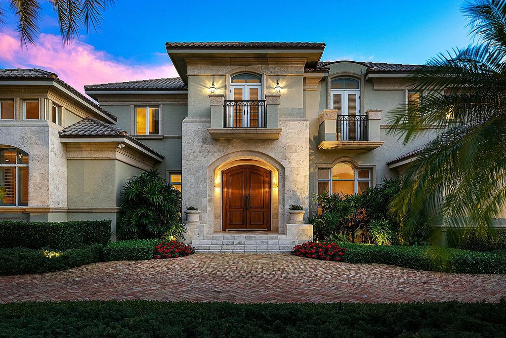 Discover unparalleled beauty in this prestigious waterfront estate located at 174 W Coconut Palm Road, Boca Raton's Royal Palm Yacht & Country Club, Florida. With captivating waterway views, this architectural marvel offers a tropical oasis on over half an acre of lush greenery.