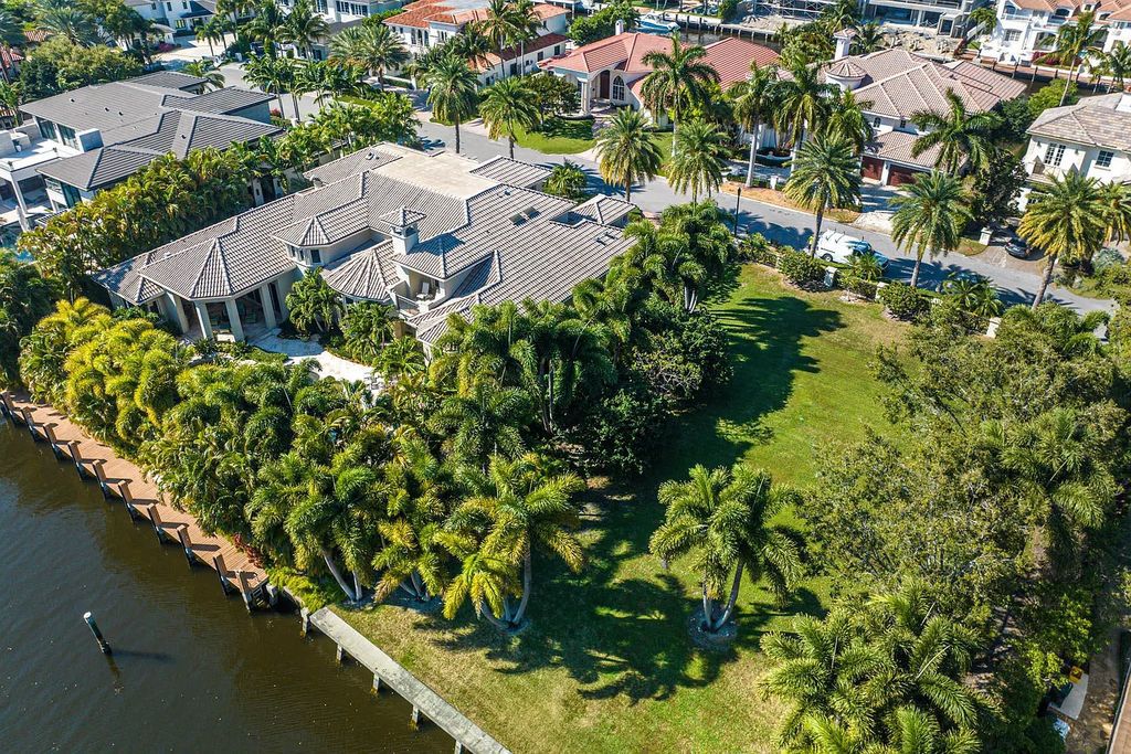 Discover unparalleled beauty in this prestigious waterfront estate located at 174 W Coconut Palm Road, Boca Raton's Royal Palm Yacht & Country Club, Florida. With captivating waterway views, this architectural marvel offers a tropical oasis on over half an acre of lush greenery.