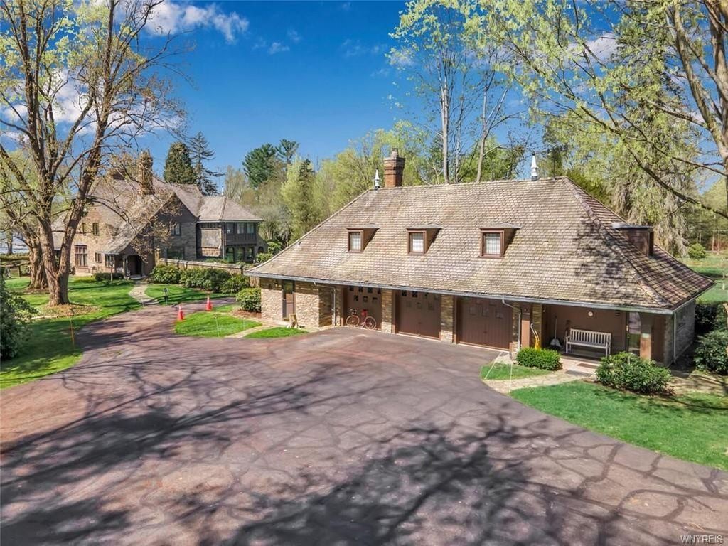 Captivating English Manor in Bemus Point, NY: A Spectacular Retreat with Stunning Water Views, Listed at $5.2M