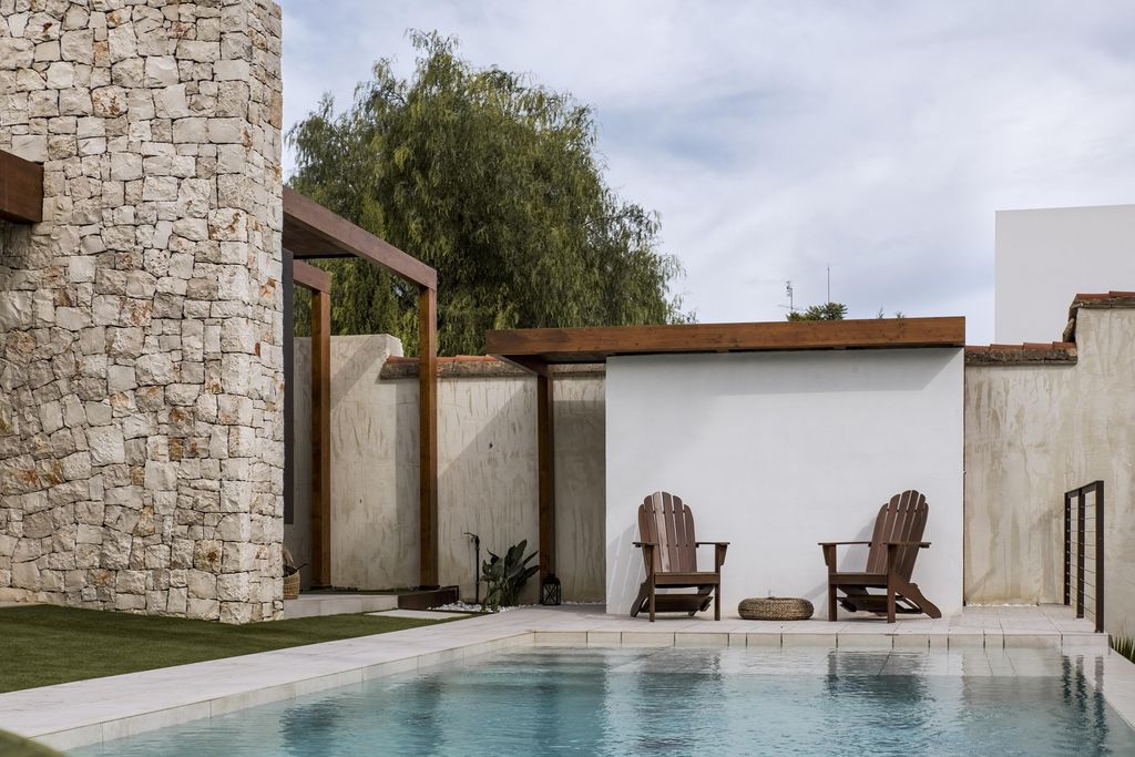 Casa R Created from two Parallel Stone Walls by Ascoz Arquitectura
