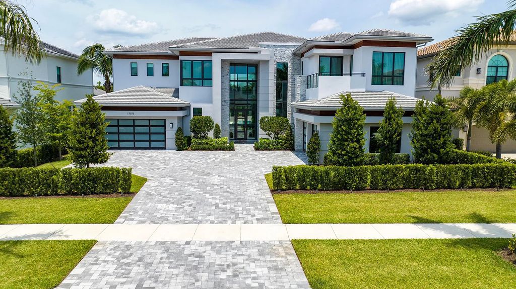 Introducing the Vanderbilt Grand, the largest model at 17073 Brulee Breeze Way, Boca Raton, Florida by GL Homes. This stunning 2022-built residence boasts 6 bedrooms, 9 bathrooms, and 8,179 square feet of pure luxury.