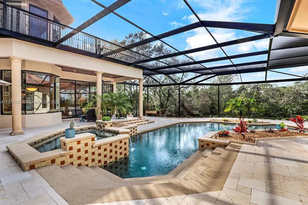 Experience unparalleled luxury living in this stunning 4 bed, 5 bath pool/spa home at 20380 Riverbrooke Run, Estero, Florida. Boasting 4,223 sq ft, it's priced below replacement value and sits on a lush .59 acre private lot.