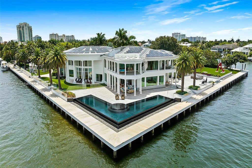 Introducing 5 Harborage, Fort Lauderdale, Florida - a premier waterfront estate in an exclusive gated community. This magnificent property offers 6 bedrooms, 11 bathrooms, and 20,000 square feet of luxurious living space.