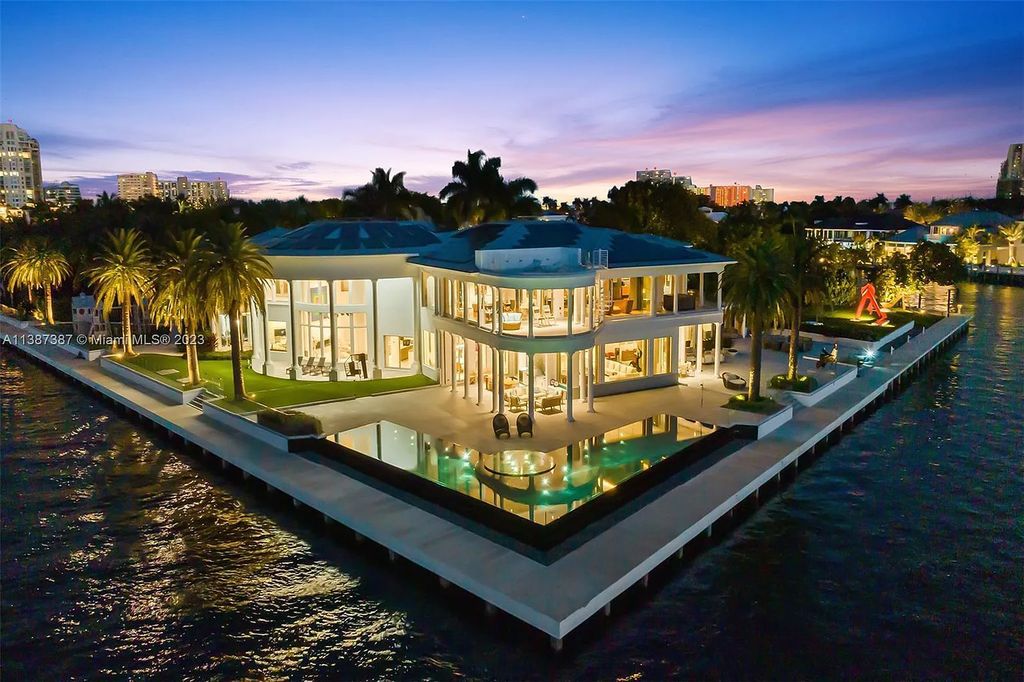 Introducing 5 Harborage, Fort Lauderdale, Florida - a premier waterfront estate in an exclusive gated community. This magnificent property offers 6 bedrooms, 11 bathrooms, and 20,000 square feet of luxurious living space.