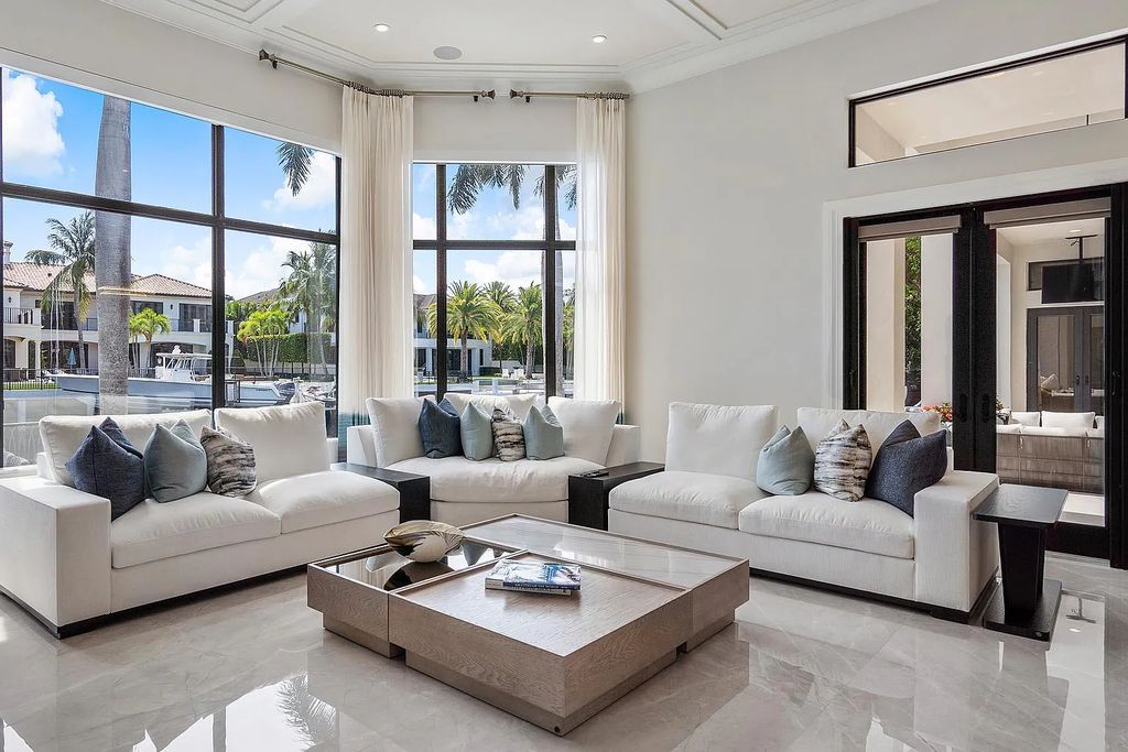 Experience the epitome of luxury living at 420 E Coconut Palm Road, Boca Raton, Florida. This meticulously renovated waterfront estate showcases 7 beds, 9 baths, and 7,216 sq ft of opulent living space.