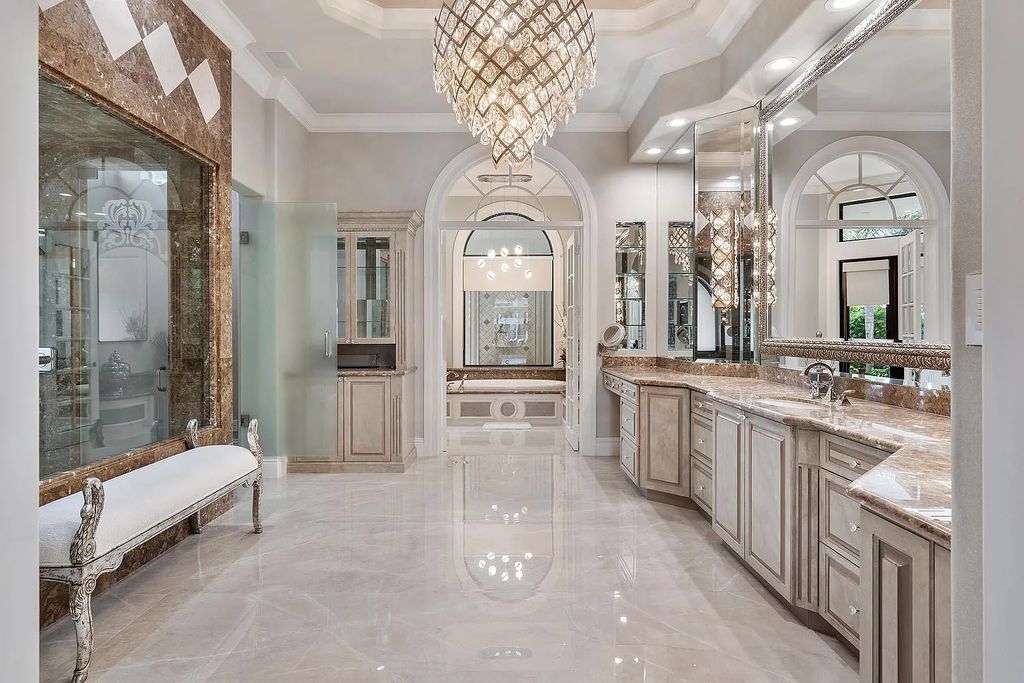 Experience the epitome of luxury living at 420 E Coconut Palm Road, Boca Raton, Florida. This meticulously renovated waterfront estate showcases 7 beds, 9 baths, and 7,216 sq ft of opulent living space.