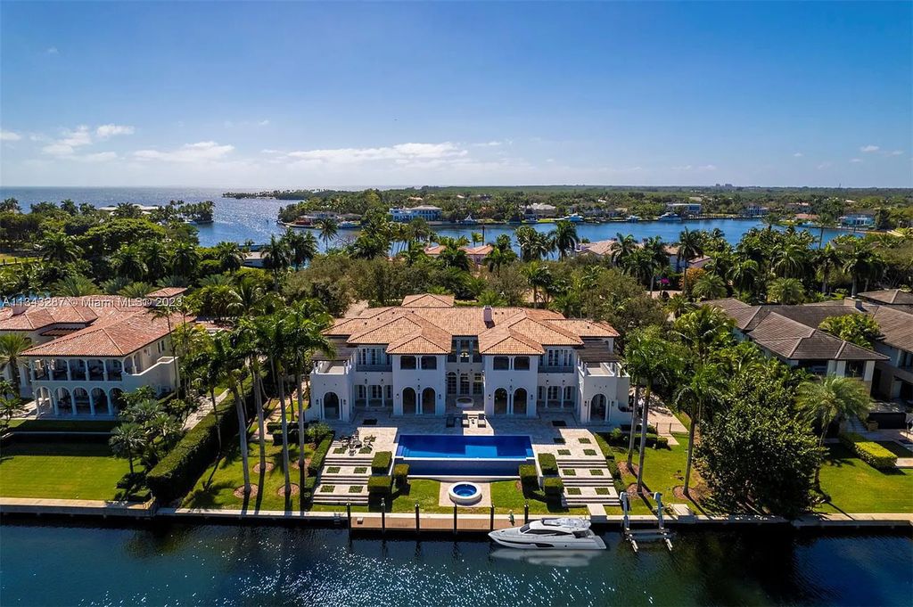 Experience luxurious waterfront living at 365 Arvida Pkwy, Coral Gables, Florida. This 11,946 sq ft masterpiece in Gables Estates offers 8 bedrooms, 11 baths, and 180 ft of waterfrontage. The main suite features a private balcony, spa-like bathroom, and walk-in closets.