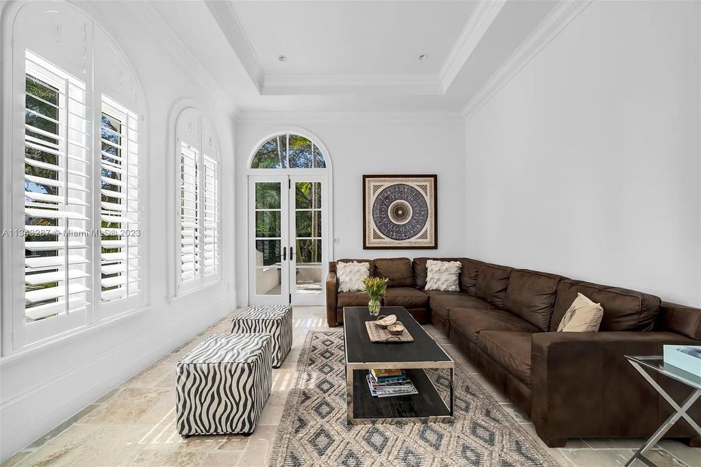 Experience luxurious waterfront living at 365 Arvida Pkwy, Coral Gables, Florida. This 11,946 sq ft masterpiece in Gables Estates offers 8 bedrooms, 11 baths, and 180 ft of waterfrontage. The main suite features a private balcony, spa-like bathroom, and walk-in closets.