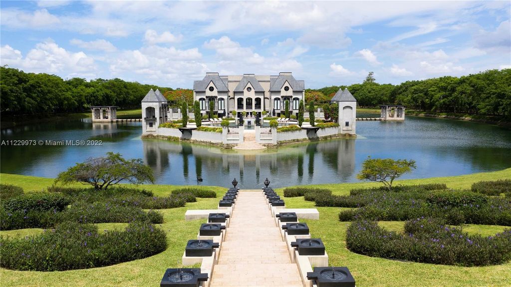 Welcome to 25791 SW 167th Avenue, Homestead, Florida - a rare chance to own the renowned mansion, designed by Architect Charles Sieger. This extraordinary 12,770 square feet estate sits on 13.74 acres in the serene Redlands area.