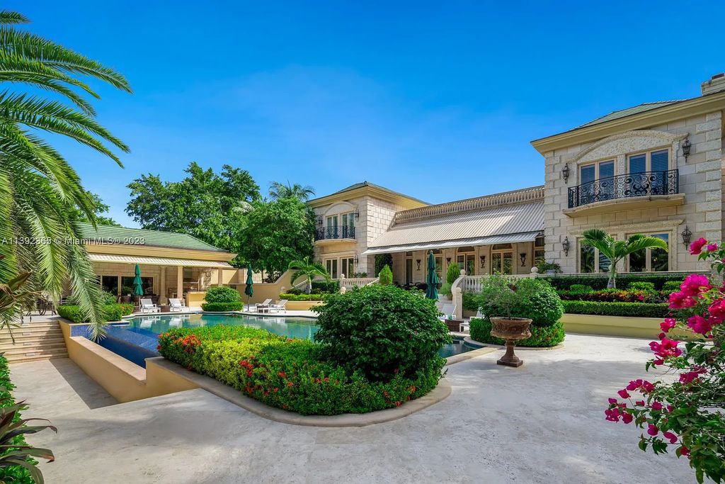 Welcome to 12 Indian Creek Island Road, Indian Creek, Florida! This stunning estate is the only available home in the exclusive Indian Creek community. With timeless European glamour and nearly 2 acres of grounds, it exudes elegance and luxury.