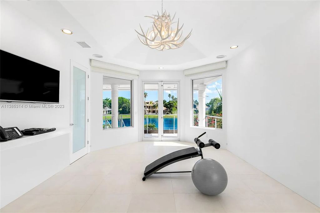 Experience luxurious waterfront living in this completely renovated Art Deco-style home at 7208 Valencia Drive, Boca Raton, Florida.