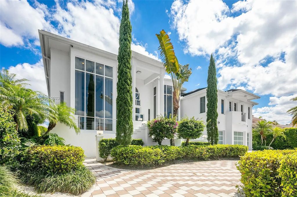 Experience luxurious waterfront living in this completely renovated Art Deco-style home at 7208 Valencia Drive, Boca Raton, Florida.