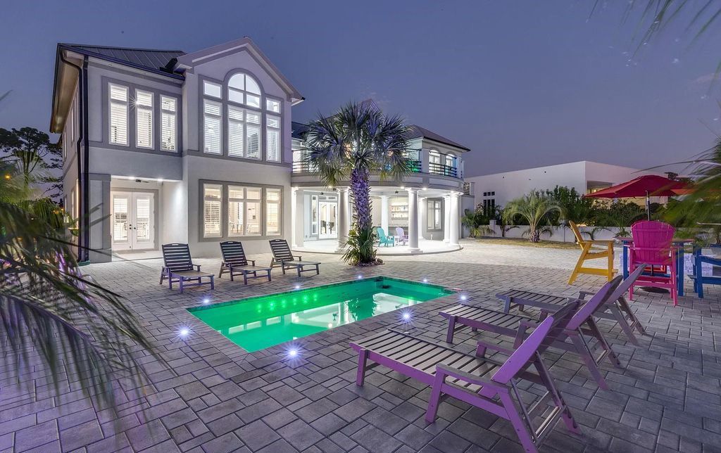 Experience ultimate waterfront living at 4522 Bay Point Road, Panama City Beach, Florida. Recently redesigned and finished in 2022, this 5-bed, 7-bath estate boasts Italian marble floors, intricate woodwork, and stunning indoor/outdoor living spaces.
