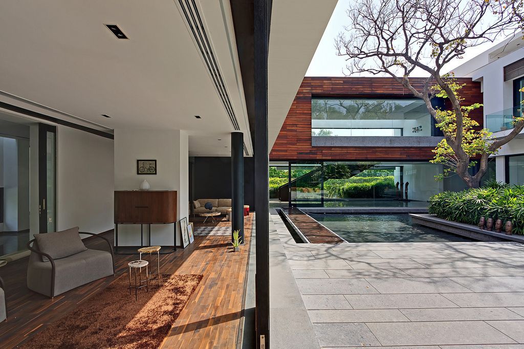 Three Trees House Preserve Trees while Enjoy Natural by DADA Partners
