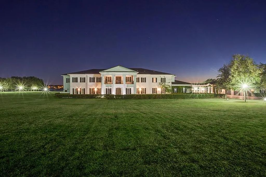 Experience luxury at 9508 Windy Ridge Road, Windermere, Florida - an exquisite lakefront estate on 18 acres with stunning views of Lake Down. This gated compound offers 7 bedrooms, 16 bathrooms, and over 29,000 square feet of living space.