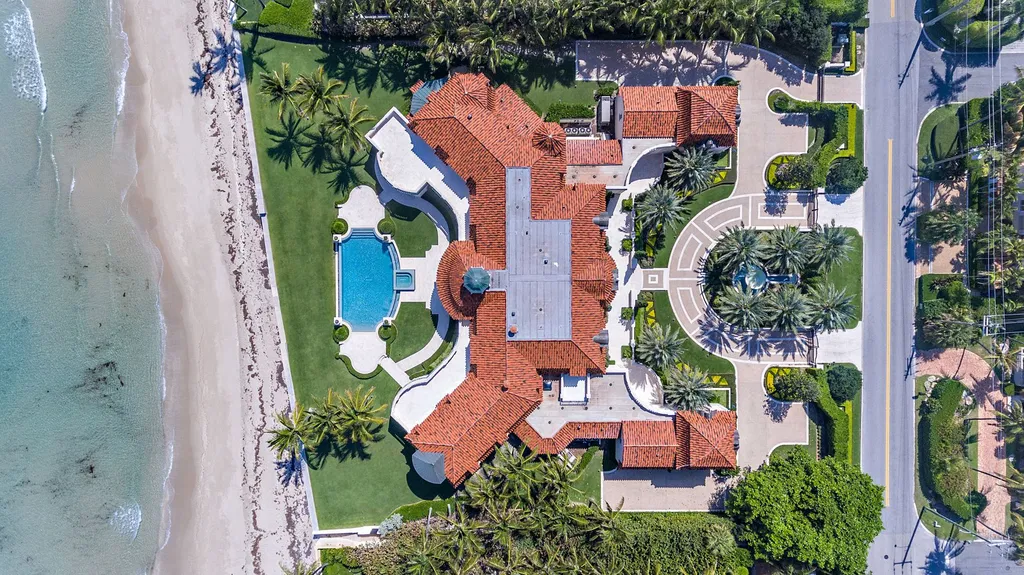 1070 N Ocean Boulevard Home in Palm Beach, Florida. Welcome to this breathtaking direct oceanfront estate, meticulously designed by Thomas Kirchhoff with stunning interiors by David Kleinberg. This exceptional home exudes grandeur and offers an excellent floor plan, featuring 7 bedrooms, 7 bathrooms, and 5 powder rooms.