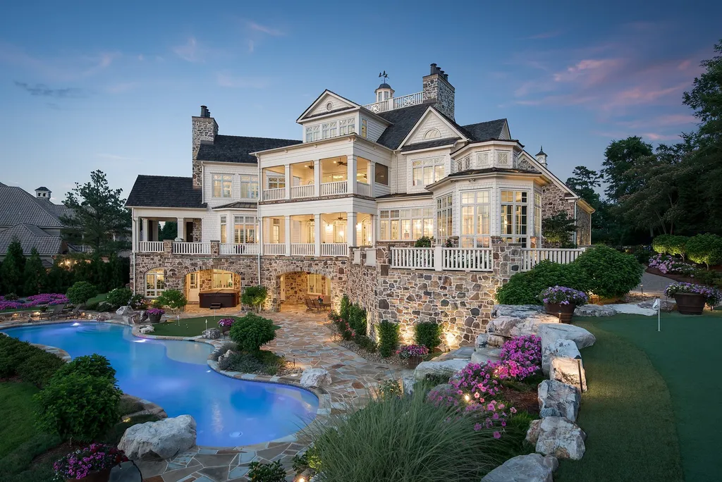 Indulge in the allure and character of the New England coast with this extraordinary Lake Norman estate. As you enter through the private gated drive, you'll be greeted by lush landscaping, creating a gardener's paradise. The estate offers wide open, long-range panoramic views that will take your breath away.