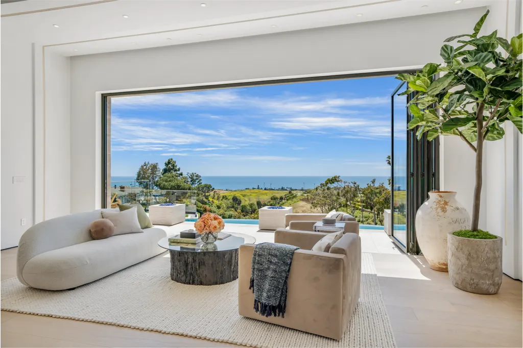 29600 Harvester Road Home in Malibu, California. Live the epitome of luxury living in pristine Malibu with this newly constructed ocean-view estate situated on 3.5 acres. Designed to embrace the indoor/outdoor lifestyle, this meticulously crafted home offers multiple hybrid living areas that seamlessly blend captivating interior design concepts with the natural beauty of the surroundings.