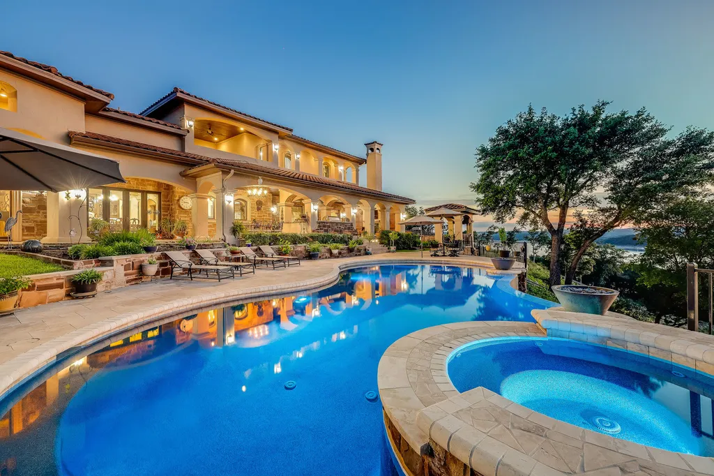 800 Watercliffe Drive Home in Lago Vista, Texas. An extraordinary Tuscan-inspired masterpiece nestled on a sprawling 3-acre waterfront lot. This meticulously designed residence boasts 8,408 square feet of luxurious living space, showcasing the timeless beauty of Tuscan architecture.