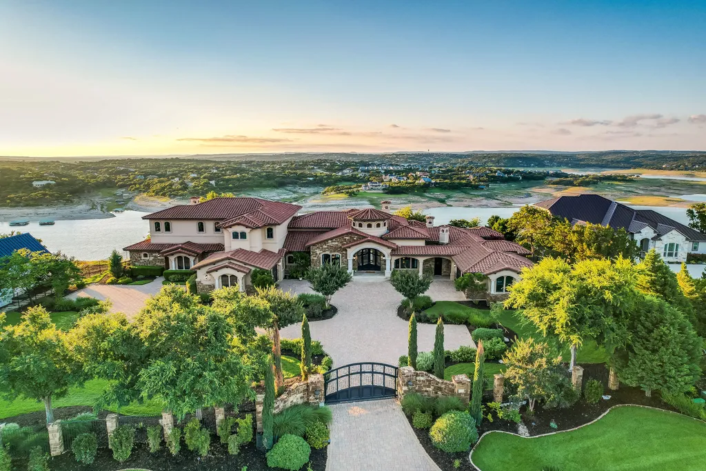 800 Watercliffe Drive Home in Lago Vista, Texas. An extraordinary Tuscan-inspired masterpiece nestled on a sprawling 3-acre waterfront lot. This meticulously designed residence boasts 8,408 square feet of luxurious living space, showcasing the timeless beauty of Tuscan architecture.