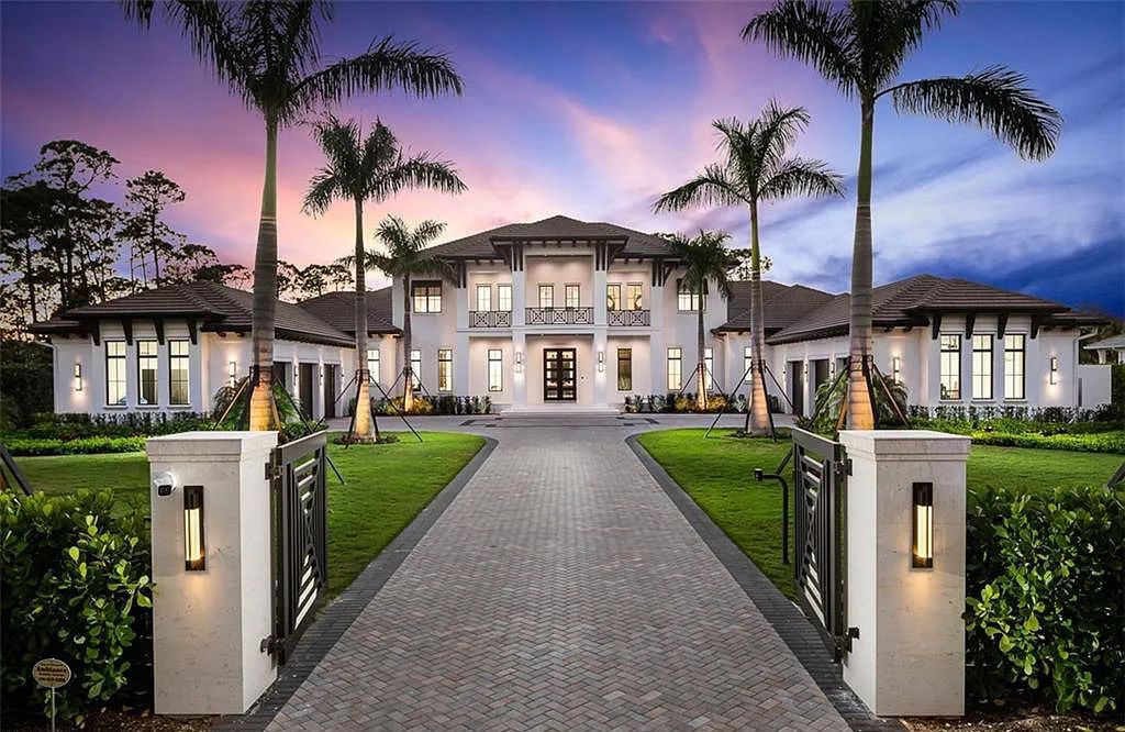 Welcome to 149 Cajeput Drive, Naples, Florida - a newly constructed masterpiece of timeless elegance. This exceptional estate boasts 5 bedrooms, 8 bathrooms, and spans 9,833 square feet.