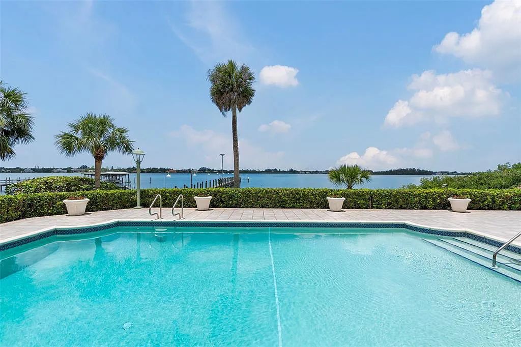 Discover 1405 Kimlira Lane, an exquisite Bayfront estate in Sarasota, Florida. Situated on 1.1 acres with 170 ft of shoreline, this 12,724 square feet masterpiece offers unparalleled luxury.