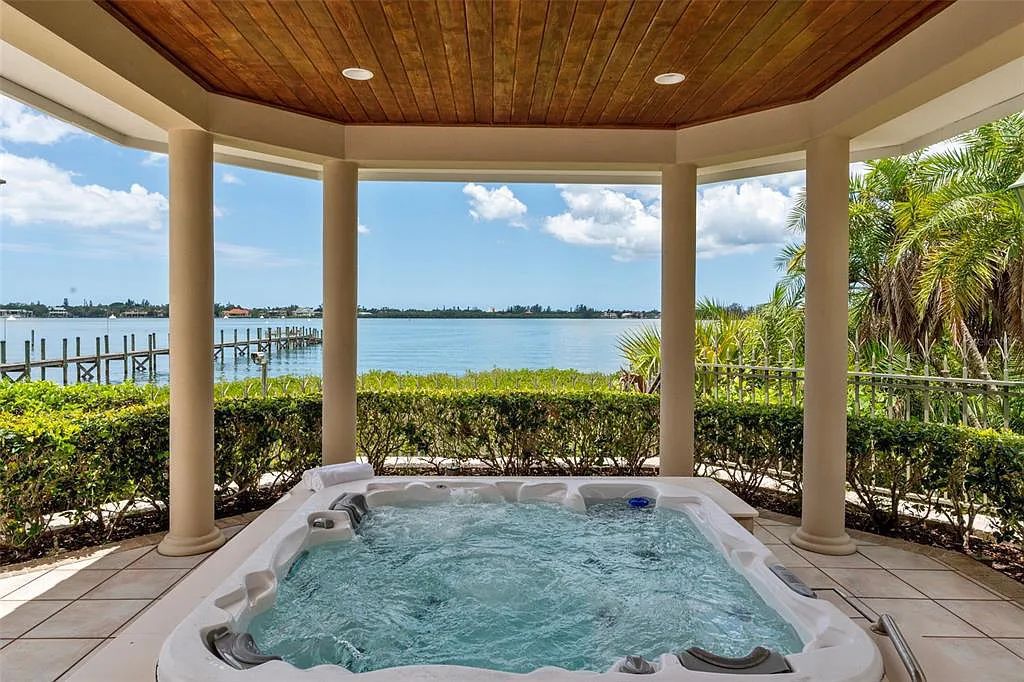 Discover 1405 Kimlira Lane, an exquisite Bayfront estate in Sarasota, Florida. Situated on 1.1 acres with 170 ft of shoreline, this 12,724 square feet masterpiece offers unparalleled luxury.