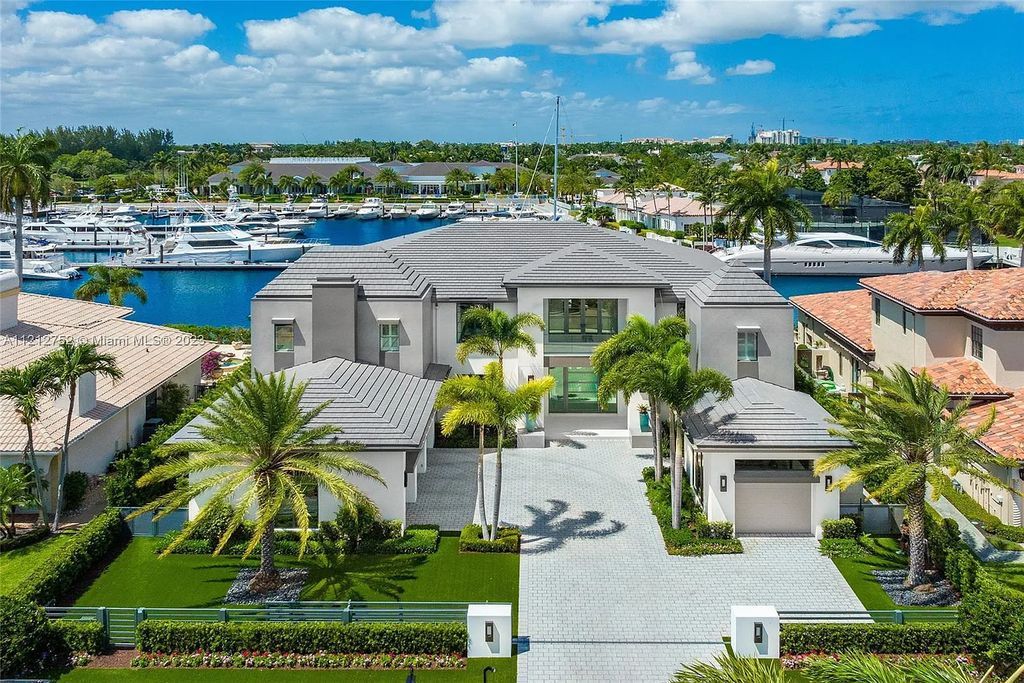 Welcome to 169 W. Key Palm Road in Boca Raton, Florida—a visionary display of contemporary design. This waterfront home is located in the exclusive Royal Palm Yacht & Country Club, offering luxurious finishes, open spaces, and breathtaking sunset views. With 6 beds, 8 baths, and 8,975 sq ft of living space, this 2021-built residence is a masterpiece.