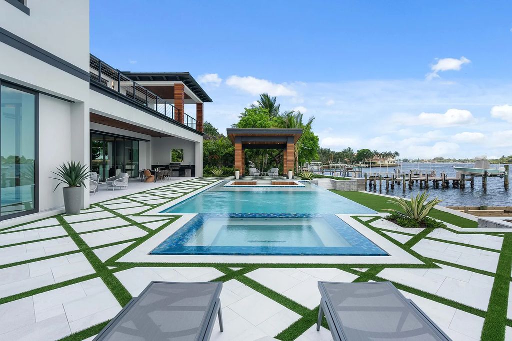 Introducing 55 River Drive, a brand new waterfront residence in Tequesta, Florida. This stunning home offers direct ocean access and boasts 100 feet of wide water views.