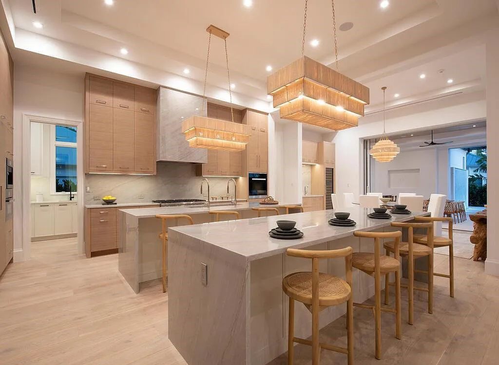 Discover luxurious living at 540 4th Avenue N in Old Naples, Florida. This brand-new home, built in 2023, features 5 beds, 6 baths, and 6,219 sq. ft. of living space.