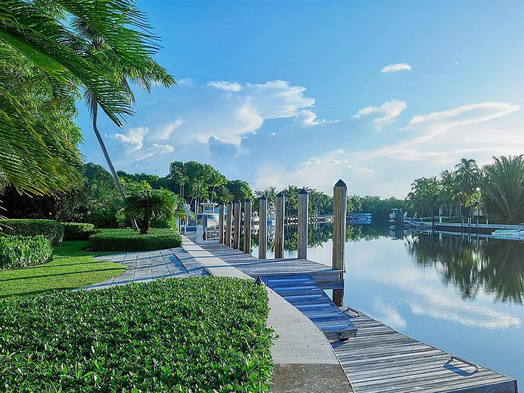 Welcome to 36 W Snapper Point Drive, a stunning waterfront estate in Key Largo, Florida. This 10,930 square feet home, nestled in the exclusive Snapper Point neighborhood, offers panoramic water views from every angle.