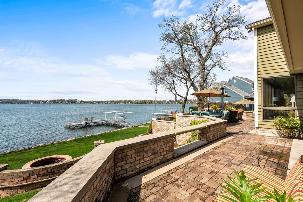 Luxurious Lakefront Retreat in Pewaukee, WI - Privacy and Serenity Await at $2.45M