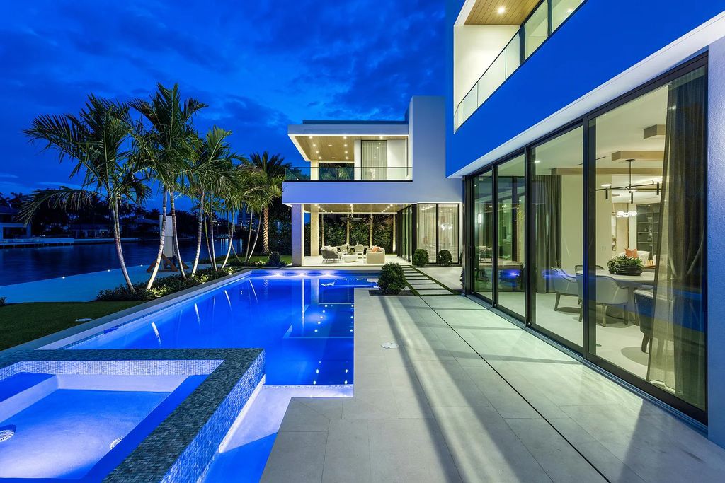 Welcome to 1099 Spanish River Road, a gated architectural masterpiece in Boca Raton's prestigious 'The Estate Section.' This newly built, five-bedroom, eight-bathroom home spans 7,602 square feet, showcasing clean lines and modern style.