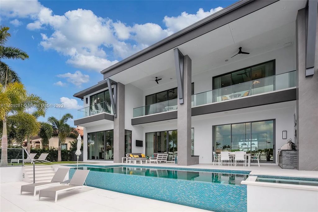 Welcome to 169 W Key Palm Road, Boca Raton, Florida—a visionary display of contemporary design in the prestigious Royal Palm Yacht & Country Club. This waterfront estate offers 6 bedrooms, 8 bathrooms, and spans 8,975 square feet of luxurious living space.