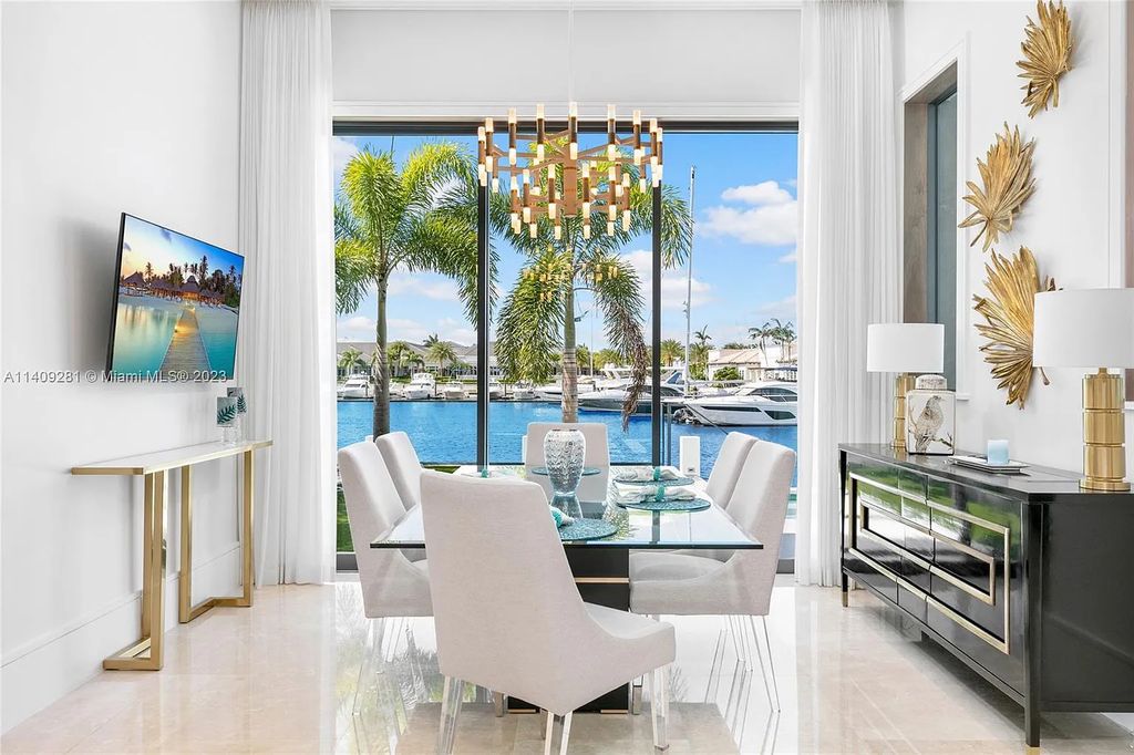 Welcome to 169 W Key Palm Road, Boca Raton, Florida—a visionary display of contemporary design in the prestigious Royal Palm Yacht & Country Club. This waterfront estate offers 6 bedrooms, 8 bathrooms, and spans 8,975 square feet of luxurious living space.