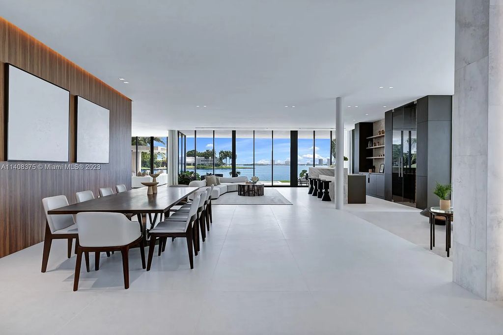 Experience luxury living at its finest in this brand-new custom residence located at 9520 W Broadview Drive, Bay Harbor Islands, Florida. With 8 bedrooms, 10 bathrooms, and over 8,200 square feet of meticulously designed living space, this modern home offers breathtaking open bay views and a seamless indoor-outdoor flow.