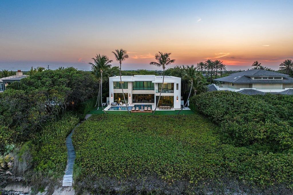 Welcome to 1115 Hillsboro Mile, a luxurious 6-bedrooms, 8-bathrooms home in Hillsboro Beach, Florida. Built in 2017 by Mark Timothy Luxury Homes and Affiniti Architects, this property offers stunning ocean views and a private boat dock.
