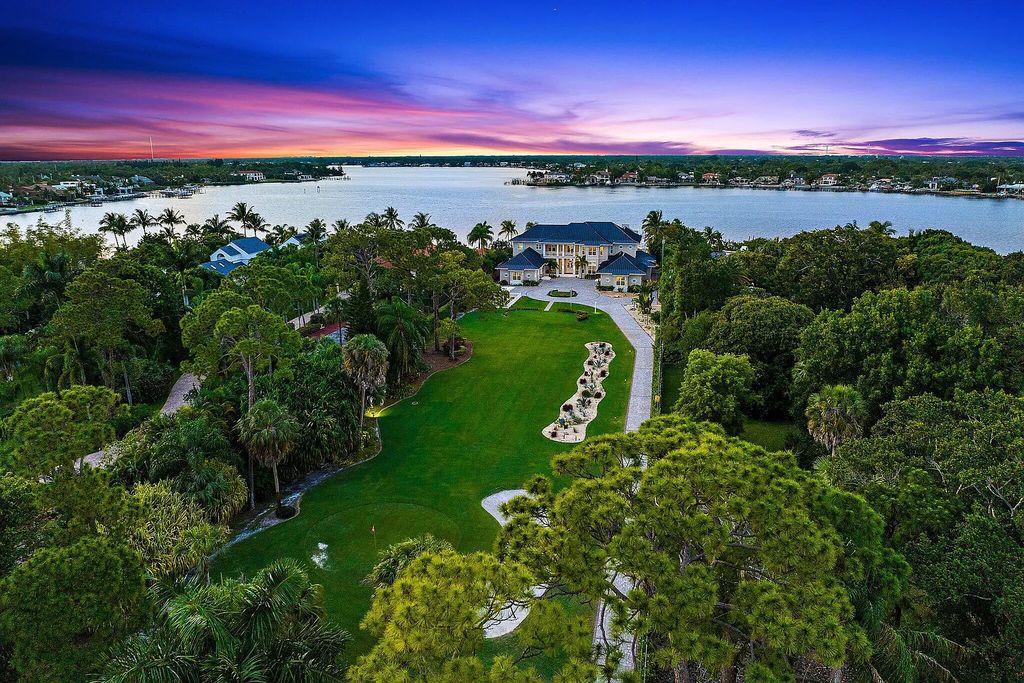 Introducing 5874 Pennock Point Road, a luxurious estate in Jupiter, Florida. This stunning property offers 5 bedrooms, 8 bathrooms, and 7,434 square feet of living space.