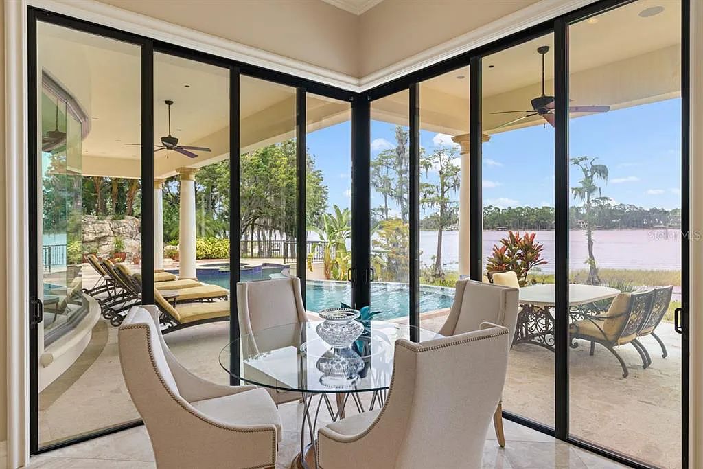 Experience luxury living at 6432 Deacon Circle in Windermere, Florida. This magnificent lakefront estate in the Isleworth Country Club Community offers impeccable craftsmanship, panoramic views, and 11,021 square feet of living space.